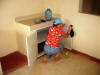 Janice cleaning cabinet