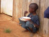 A solitary boy waiting on a home