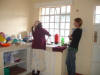 Momma Dorcas working in kitchen