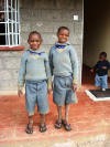 Two of the boys in school uniform