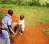 Godfrey & Kelvin playing with tire