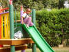 Hezekiel going down slide at hospital