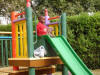 Tyson going down the slide at the hospital