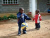 Joshua playing with Godfrey's ball